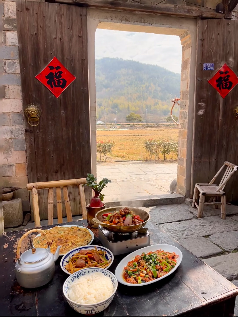 A home-cooked Huizhou lunch laid out in a village home