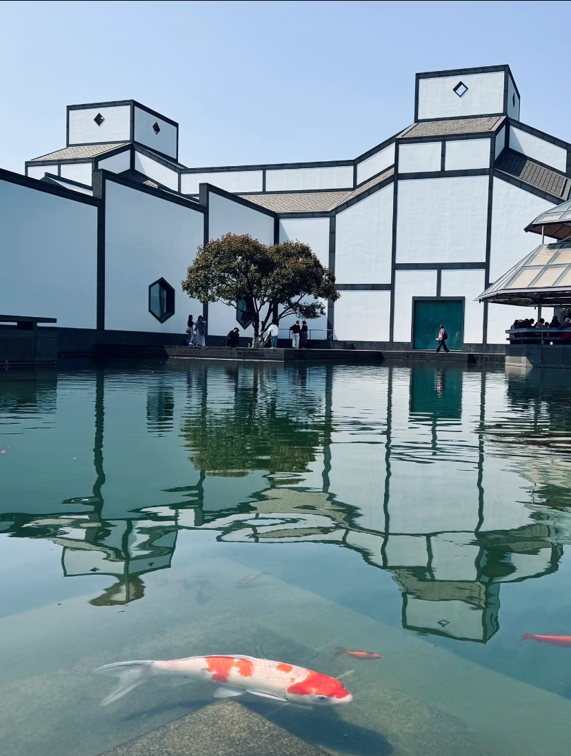 The Suzhou Museum by I. M. Pei reflected in its koi pond